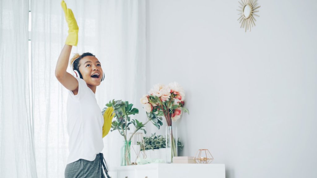 Cleaning professional at work in a bright home